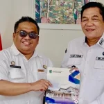 Kepala Dinas Tenaga Kerja dan Transmigrasi Muba, Herryandi Sinulingga bersama Bupati Muba Toha. Kepala Dinas Tenaga Kerja dan Transmigrasi Muba, Herryandi Sinulingga bersama Bupati Muba Toha.